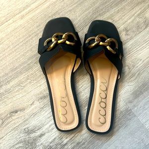 Ccocci black and gold slip ons